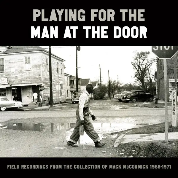 Playing For The Man At The Door